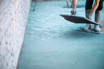 Man Stamping Concrete